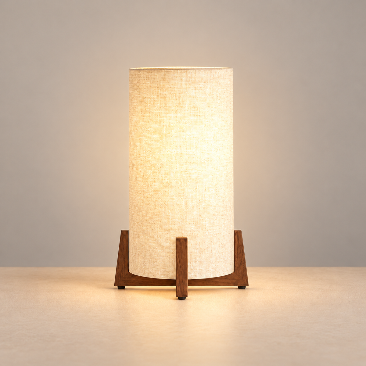 Wood and Linen table lamp illuminated on a beige background